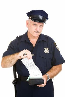 Officer writes speeding ticket
