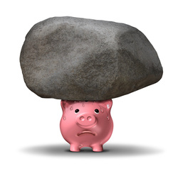 Piggy bank under rock
